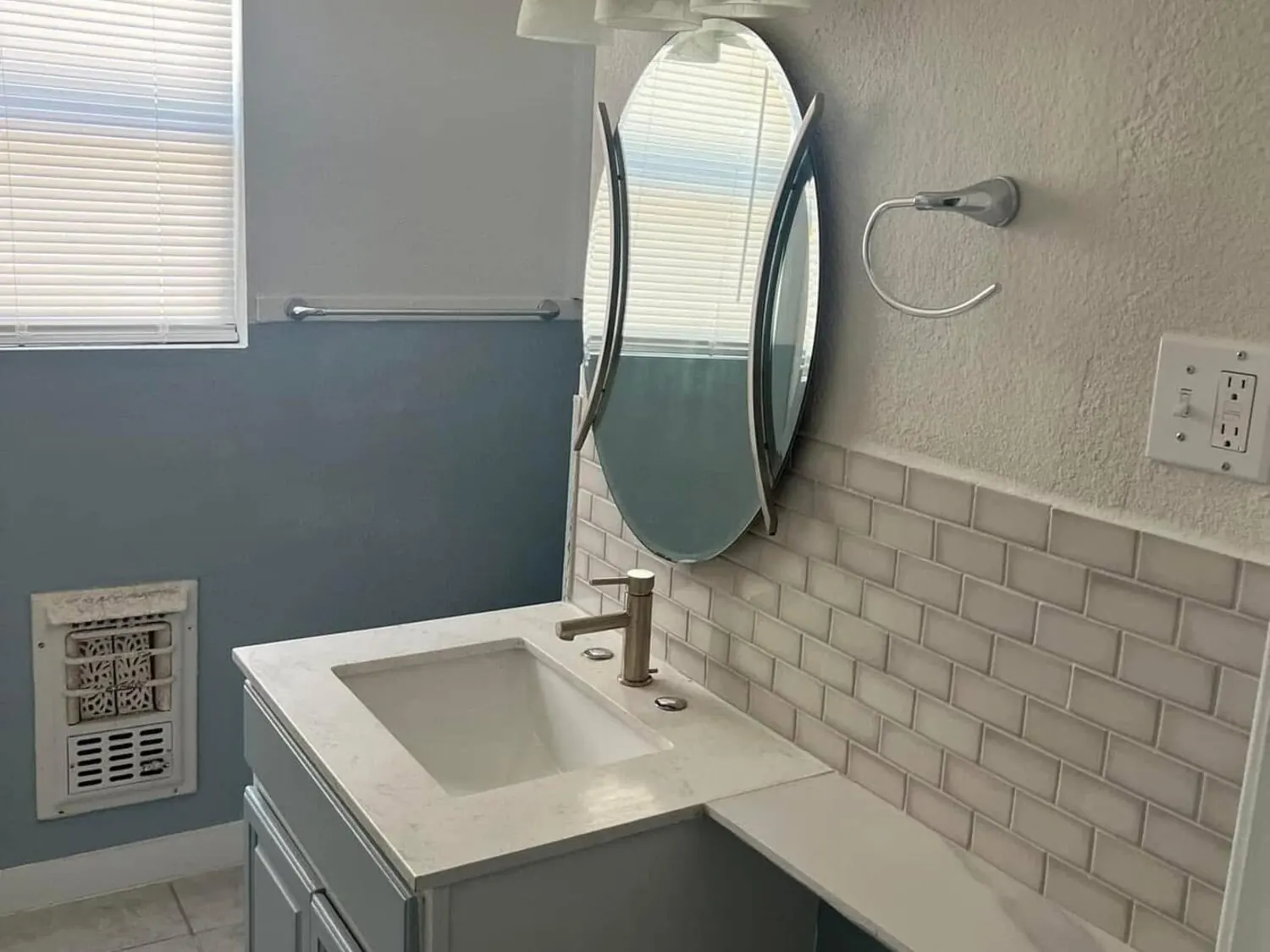 Bathroom after remodel with vanity and tile