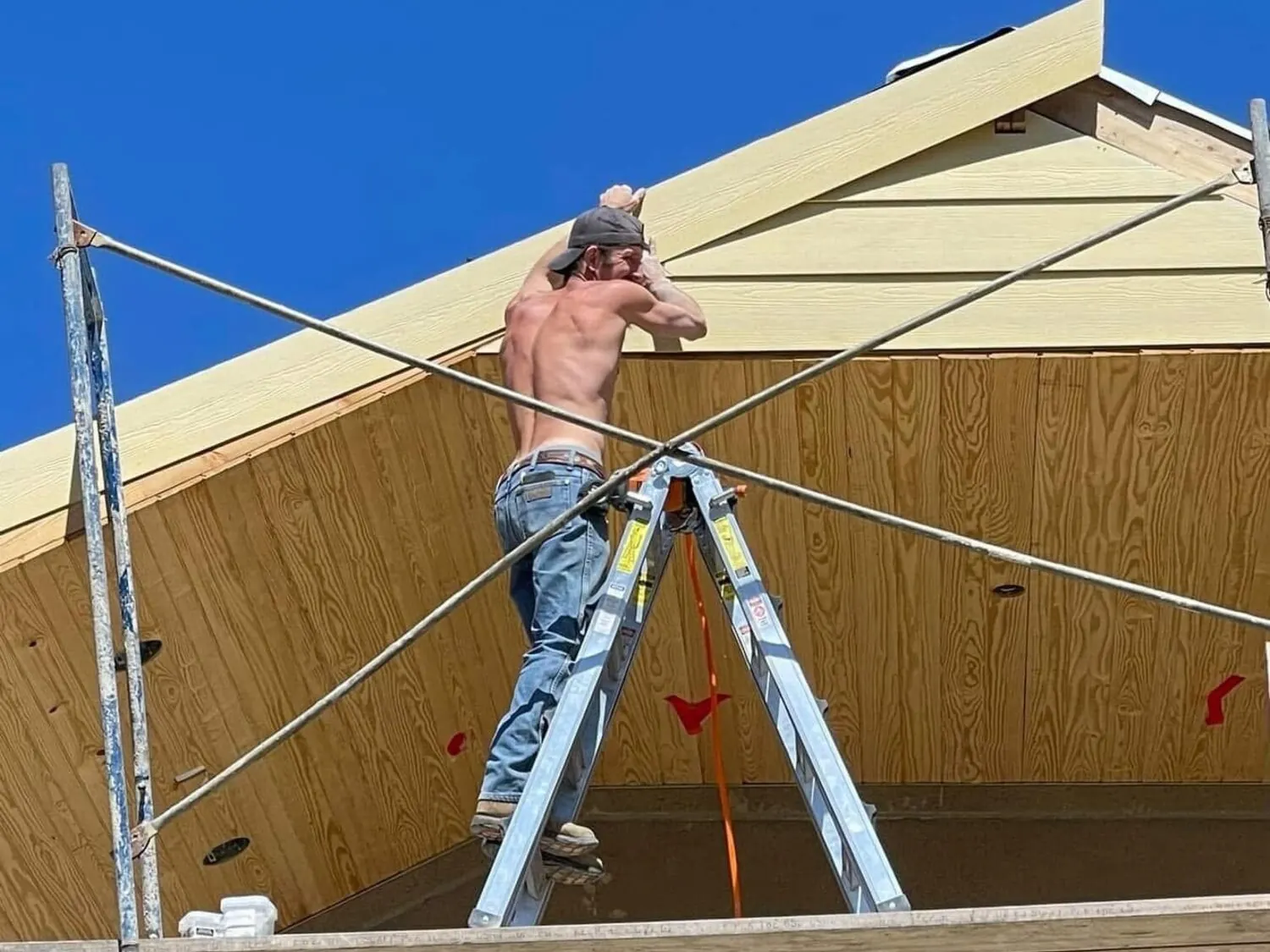 Siding work underway at height